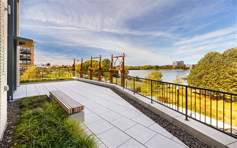 Roof terrace design options for a central london penthouse space that includes planting design, outdoor lounge, and dining, informal seating and lawn area. Office Building, Somerville, MA | ZinCo Green Roof Systems UK