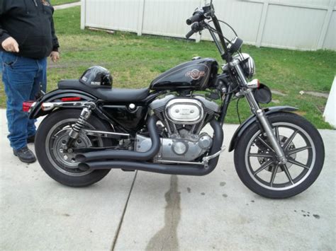 Fists in the wind attitude with a conservative rise and bend for rider comfort. 1997 Harley Sportster 1200 CUSTOM LOW MILES done up nice ...