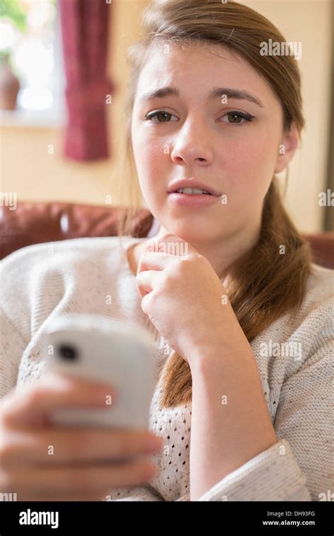 Teenage Girl Looking At Cellphone Sad Hi Res Stock Photography And
