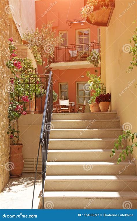 Photo Made In Greece Patio In Greece With Stairs And Flowers Stock