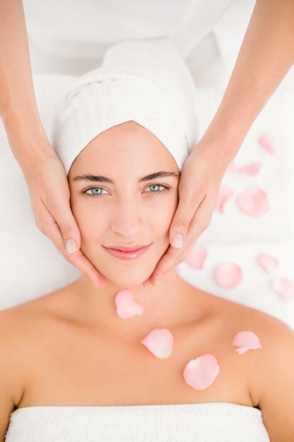 Premium Photo Attractive Woman Receiving Facial Massage At Spa Center