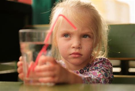 Child Drinks Water Funny Baby Girl Drinking From Glass Stock Photo
