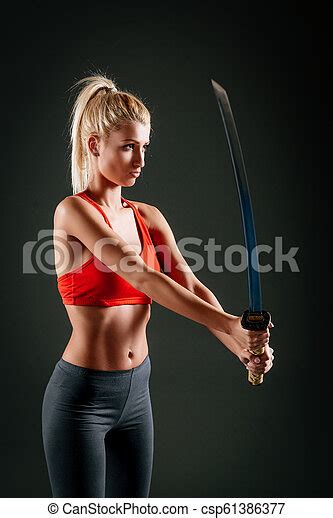 woman with katana beautiful woman with a serious expression on her face holding sword canstock