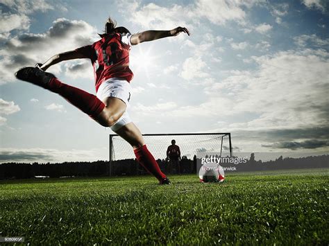 Female Soccer Player Kicking Ball Toward Goal Stock Photo Getty Images