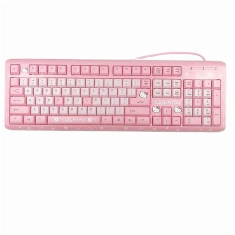 A Pink Computer Keyboard Sitting On Top Of A White Surface