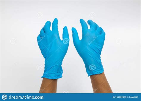 Woman Hand Wearing A Blue Rubber Medical Glove On White Isolated