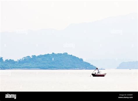 Fisherman Over The Mountain And The Sea Alone Stock Photo Alamy