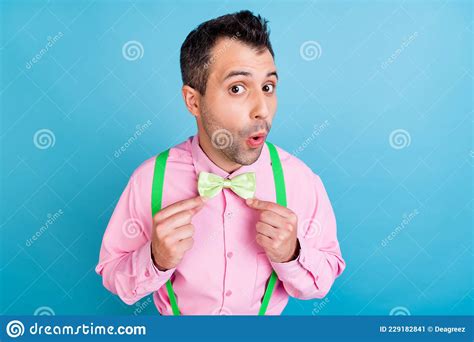 Photo Of Shocked Handsome Guy Open Mouth Wear Green Suspenders Shirt Bow Tie Isolated Blue Color