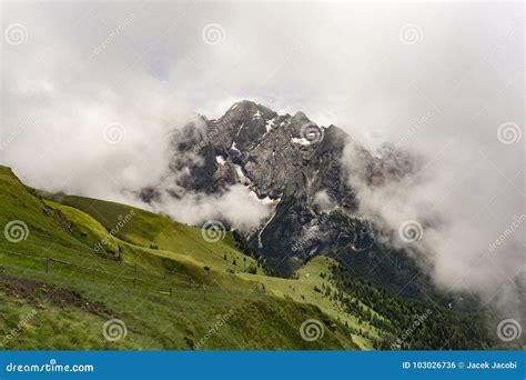 Beautiful View Of The Marmolada Massif Between Clouds Dolomites Italy