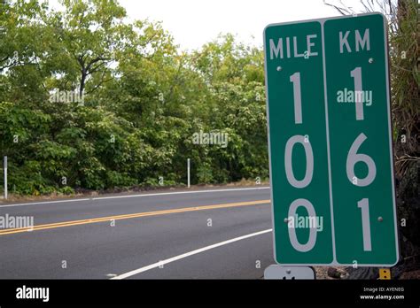 Roadside Mile Marker Showing Measurements In Miles And Kilometers On