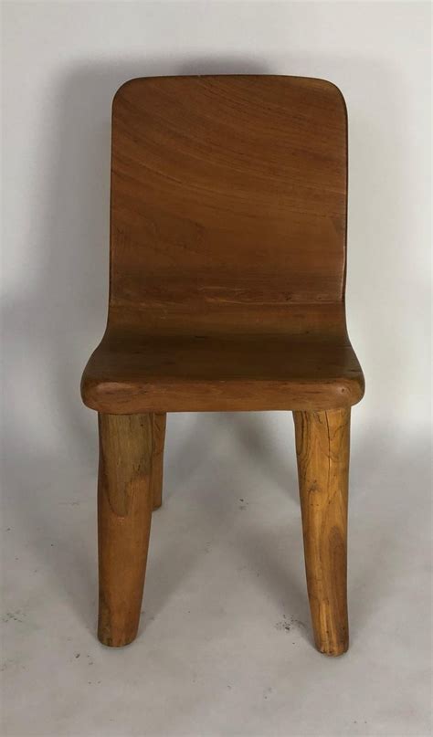 In order for a barber chair to be vintage, it must be at least 20 years old and at least 100 years old to be considered antique. Unique Carved Teak Chair #3 For Sale at 1stdibs