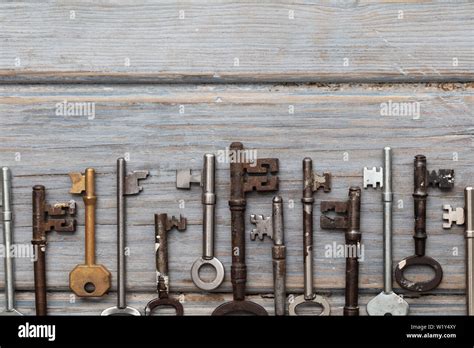 Vintage Old Fashioned Keys On A Rustic Wooden Background Security