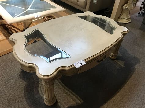 Modern and clean, the coffee table is the picture of contemporary living with a casual twist. MICHAEL AMINI TRADITIONAL STYLE GLASS ACCENTED COFFEE ...