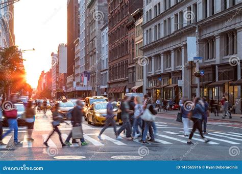 Crowds Of People In Motion Across The Busy Intersection Of 23rd Street