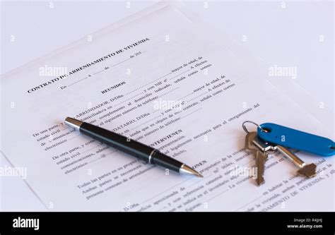 Spanish Lease Rental Agreement Document With Keys And Pen Stock Photo