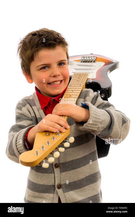 Boy Holding A Guitar Over His Shoulder Stock Photo Alamy