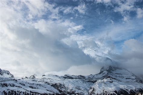 Free Stock Photo Of Clouds Over Snow Covered Mountain Tops