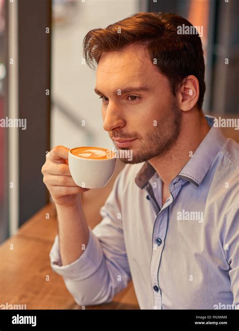 Handsome Man Drinking Coffee Stock Photo Alamy