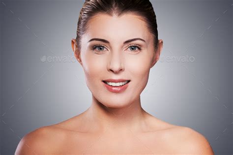 Natural Beauty Portrait Of Shirtless Mature Woman Smiling While