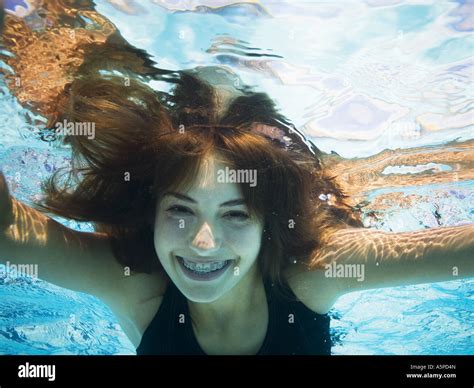 Girl Swimming Underwater In Pool Stock Photo Alamy