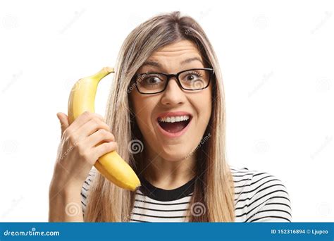 Surprised Young Woman Holding A Banana Stock Photo Image Of