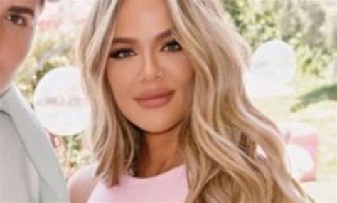 khloe kardashian shows off her tiny waist in a crop top and skin tight leggings in new photos