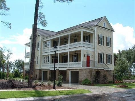 A narrow house lot near the beach or other odd shaped waterfront lot on a river or lake can be a challenge. Front Elevation | Charleston house plans, Charleston homes