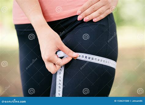 Woman Measuring Her Thigh With Measure Tape Stock Photo Image Of