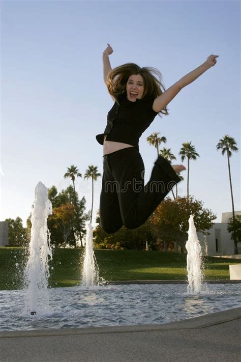 Hooray Woman Jumping For Joy Near A Fountain Affiliate Woman