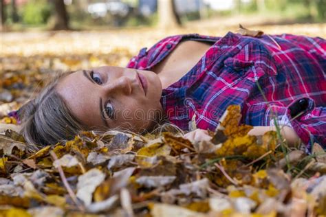 A Lovely Blonde Model Enjoys An Autumn Day Outdoors At The Park Stock Image Image Of
