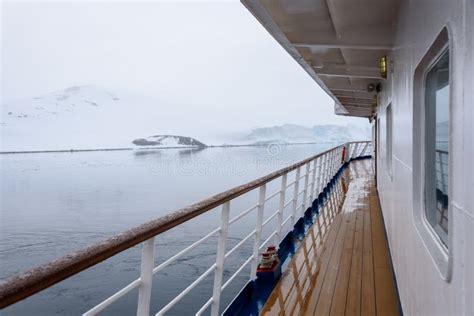 View Of Snow Covered Shoreline From Outside Deck Of Cruise Ship