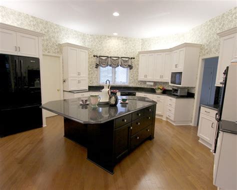 Fresh kitchen with its gorgeous view from backsplash windows. Refaced White Kitchen Cabinets with Black quartz countertop