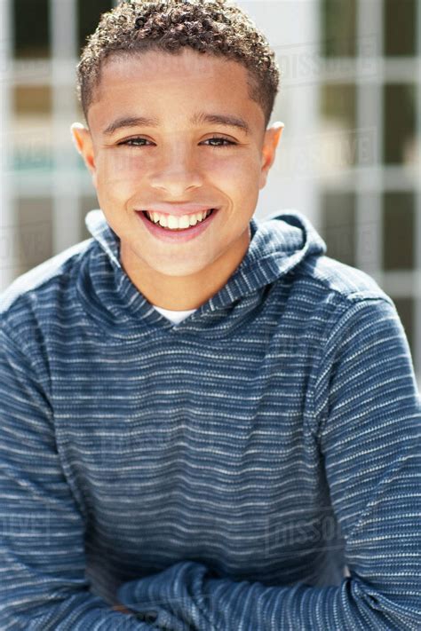 Close Up Of Mixed Race Boy Smiling Outdoors Stock Photo Dissolve