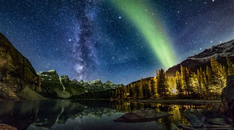 A Golden Green Aurora Shines Over Moraine Lake In This Skywatcher Image
