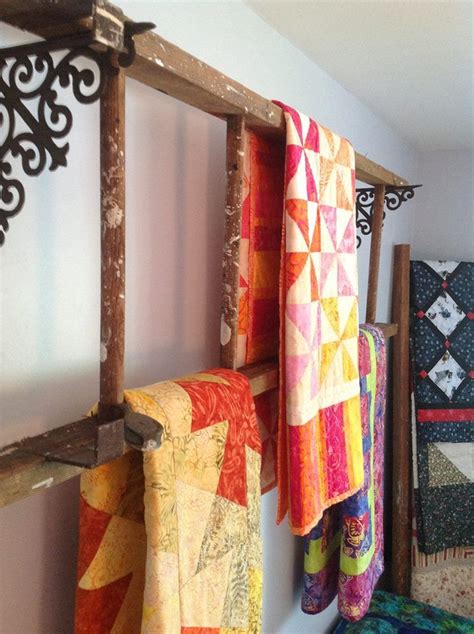 displaying quilts on old wooden ladders home decor repurposed ladders decor