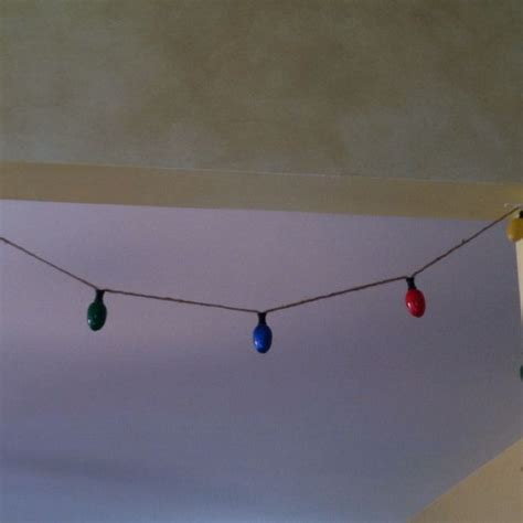Diy Christmas Light Garland Made Out Of Twine Tiny Thread Spools