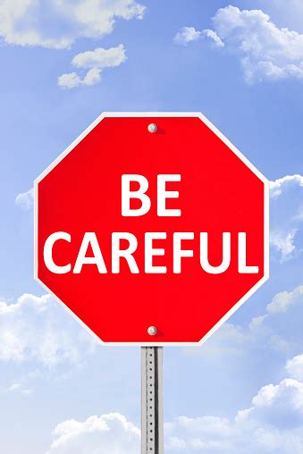Be Careful Warning Sign Against Blue Sky Stock Photo Download Image
