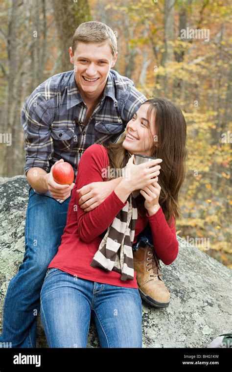 Happy Young Couple In Forest Stock Photo Alamy