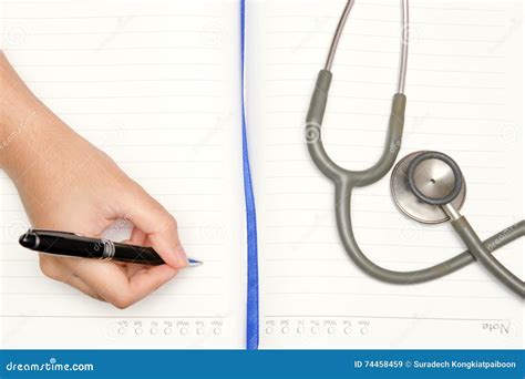 Write Activity With A Pen Book And Doctor Stethoscope Stock Image