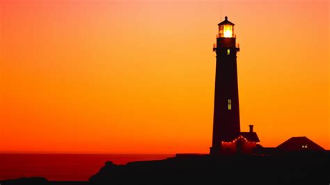 Lighthouse Silhouette In The Sunset Backiee