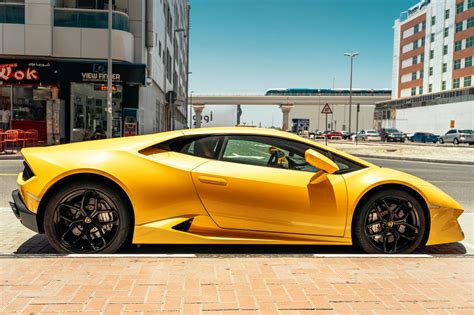 Photo Of Yellow Lamborghini Parked Beside Road · Free Stock Photo