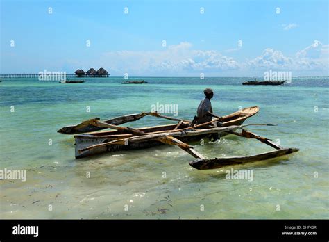 Fisherman And Traditional Dhow Boat Bwejuu Beach Indian Ocean