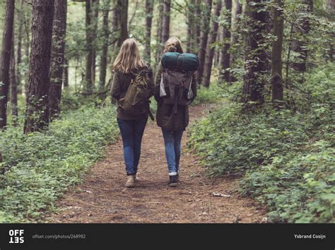 Two Sisters Walking Together On A Hiking Trail Stock Photo Offset