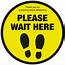 Please Wait Here With Symbol Social Distancing Floor Sign  Catersign