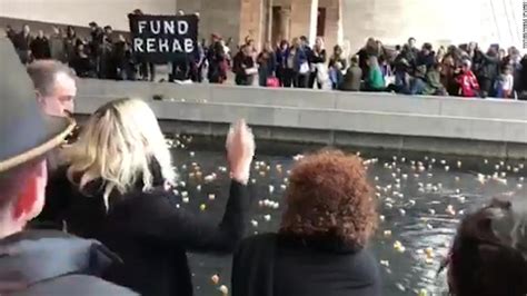 protesters throw pill bottles in famous museum cnn video