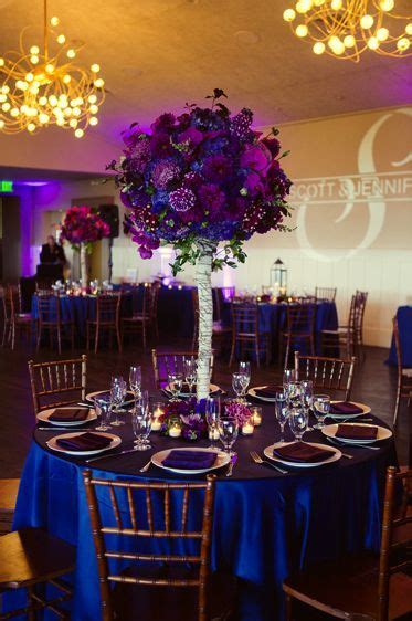 Royal blue theme wedding decorations and centerpieces. Purple and Blue Wedding Color Theme. Blue linens with ...