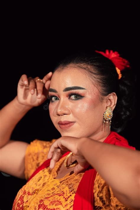 A Sharp Gaze From An Indonesian Woman With Makeup On Her Face While