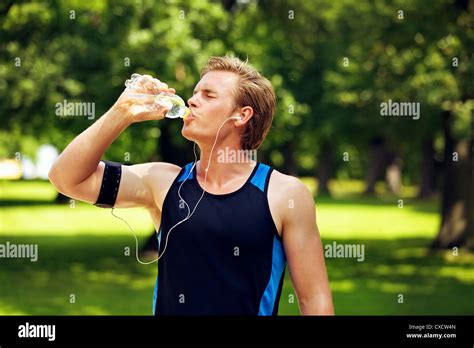 Thirsty Athlete Drinking Water After Workout Stock Photo Alamy