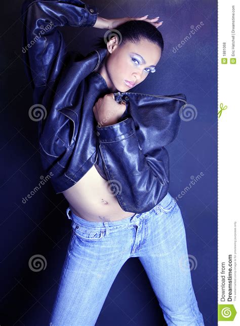 Teenage African American Girl Wearing A Leather Jacket Showing Her