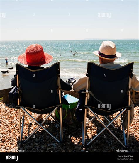 Monday 23rd July 2012 West Wittering Beach West Sussex England Uk A Retired Couple Enjoy